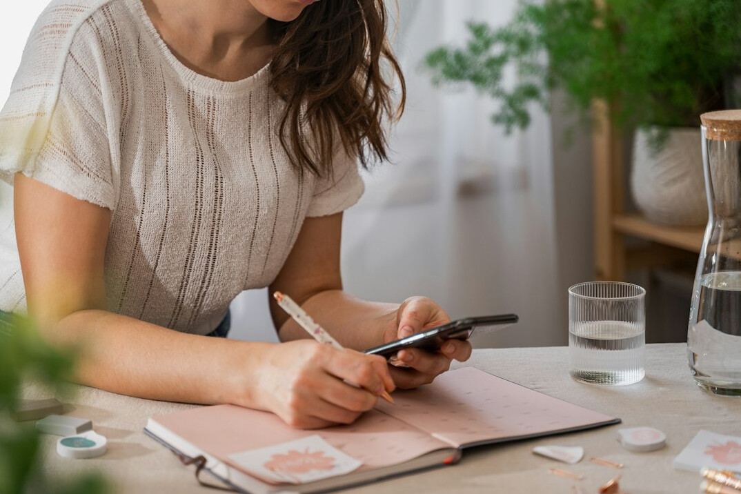 woman writing to do list